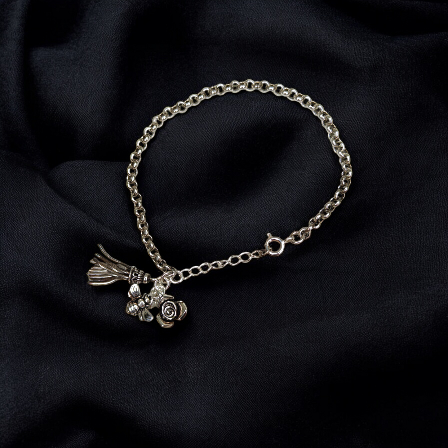 Silver Charm Bracelet with Intricate Details