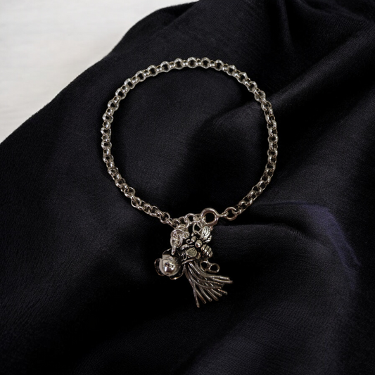 Silver Charm Bracelet with Intricate Details