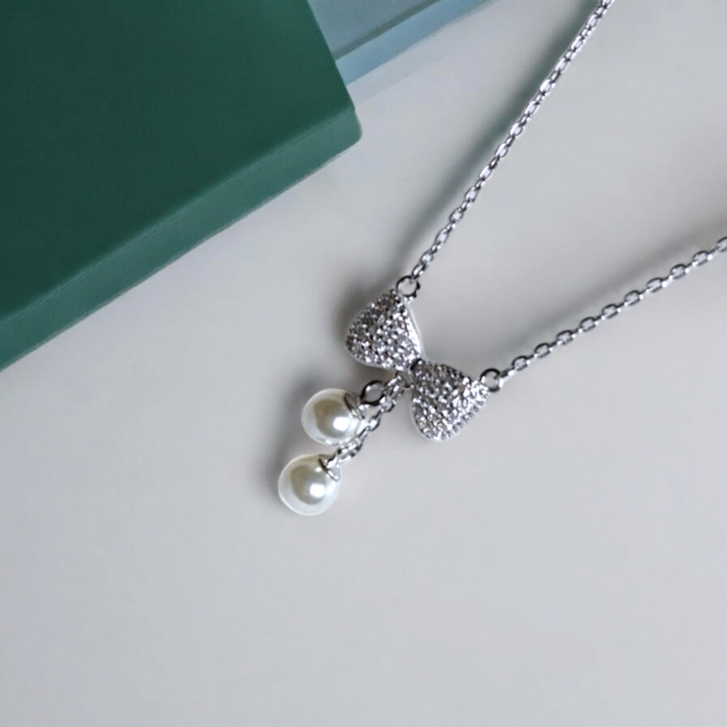 The Bow Charm Pearl Drop Necklace