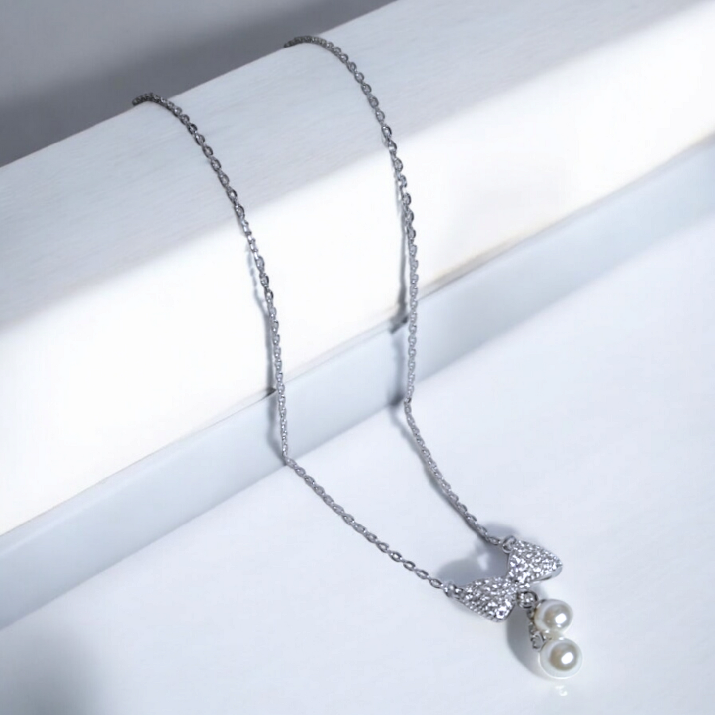 The Bow Charm Pearl Drop Necklace