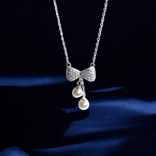 The Bow Charm Pearl Drop Necklace